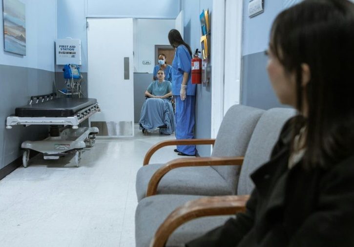 Woman waiting in a foreign hospital