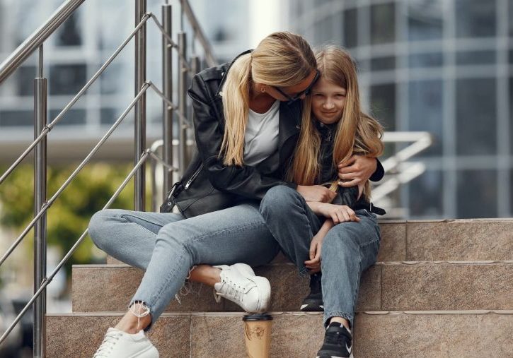Woman and daughter talking about cultural differences